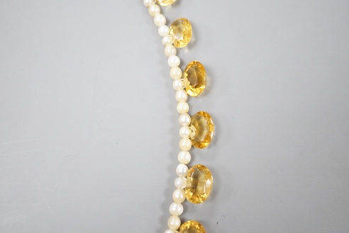 A single strand oval cut citrine and seed pearl set fringe necklace, with 9ct clasp, 44cm